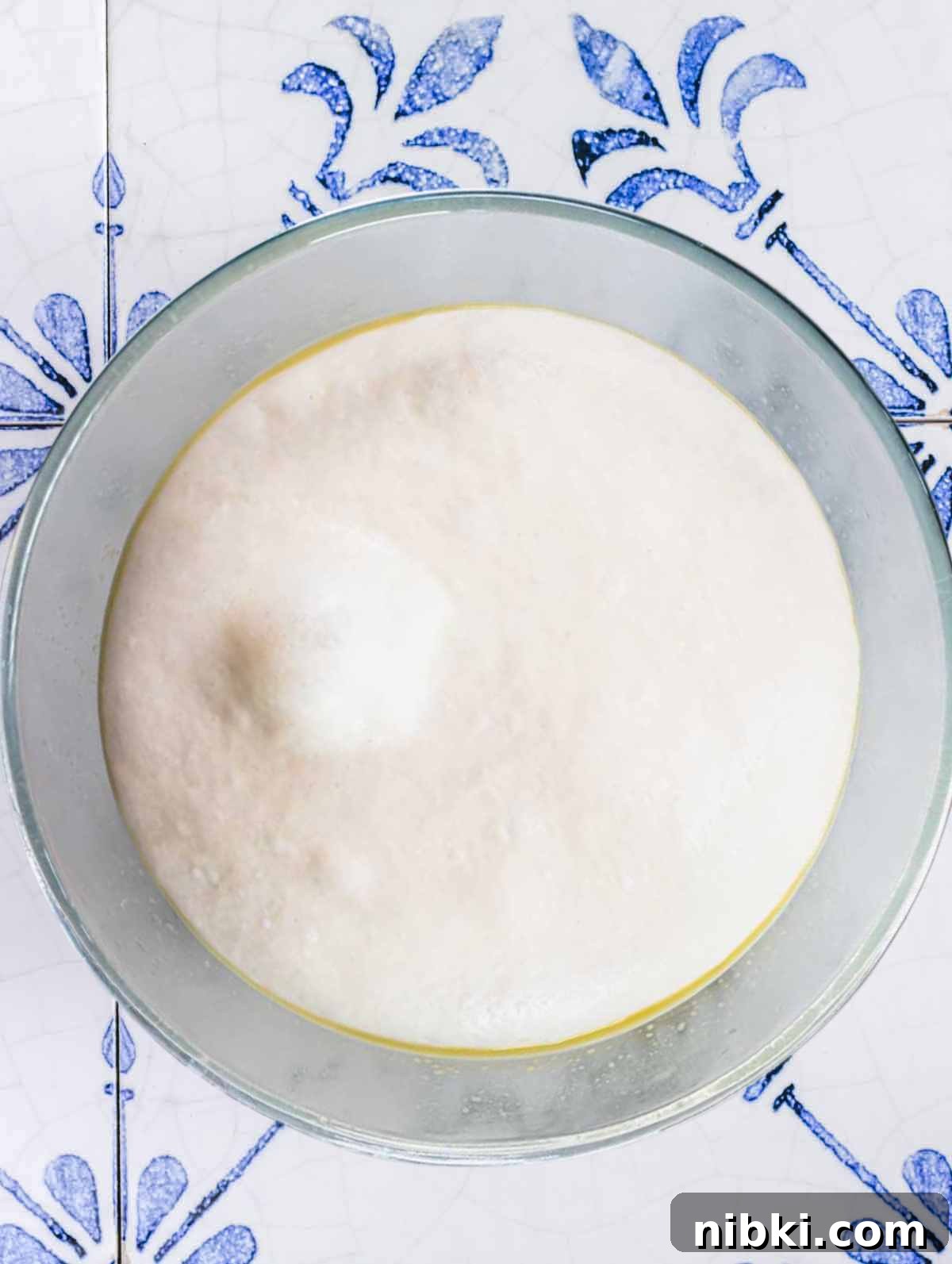 quick pizza dough proofed in a bowl