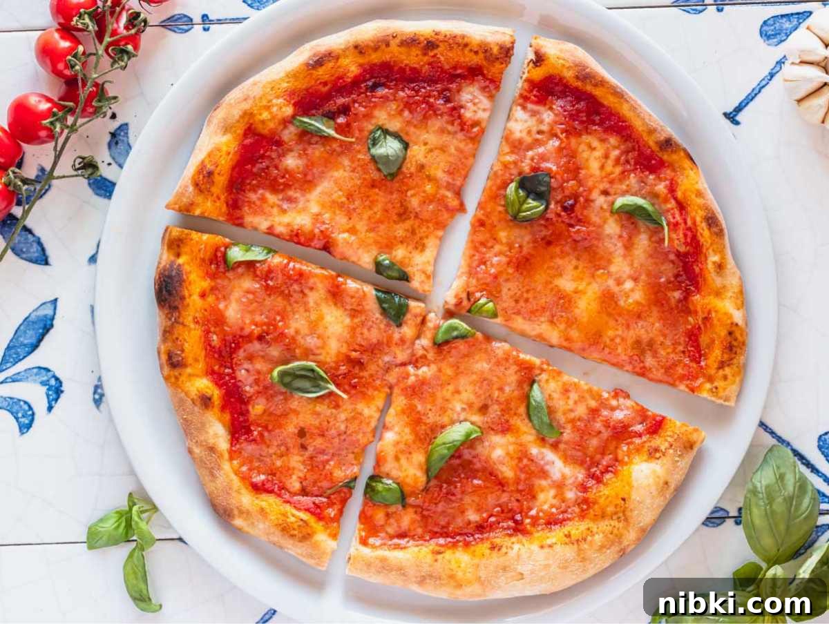 homemade pizza with tomato, cheese and basil