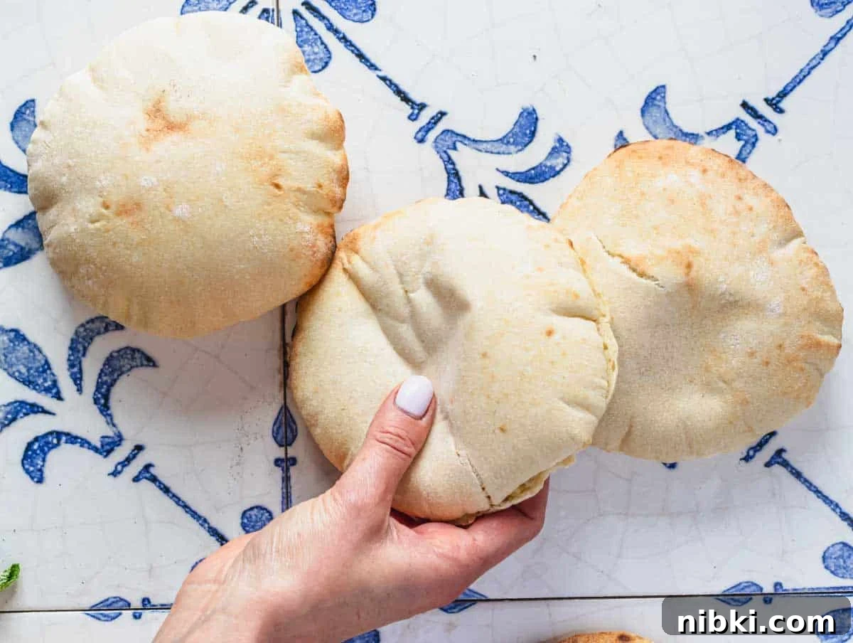 Louise preparing freshly bake pita bread