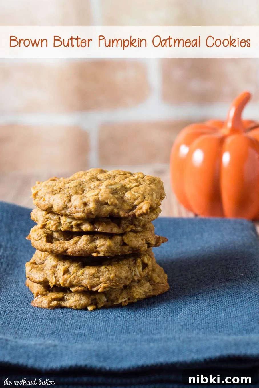 These chewy pumpkin oatmeal cookies are flavored with spices and nutty browned butter, and are loaded with caramel chips. #PumpkinWeek