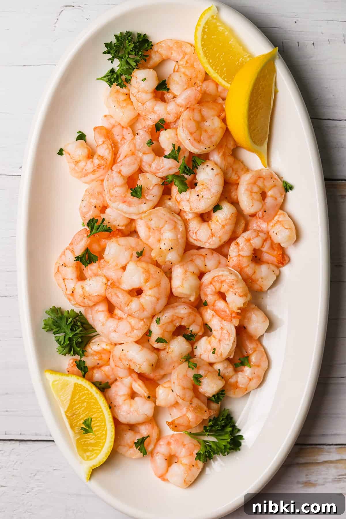 How to Cook Crispy Frozen Shrimp in the Air Fryer 6 cooked shrimp on a platter