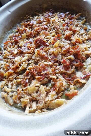 Creamy Slow Cooker Green Bean Casserole with Bacon 7 Step 4 top with bacon and fried onions