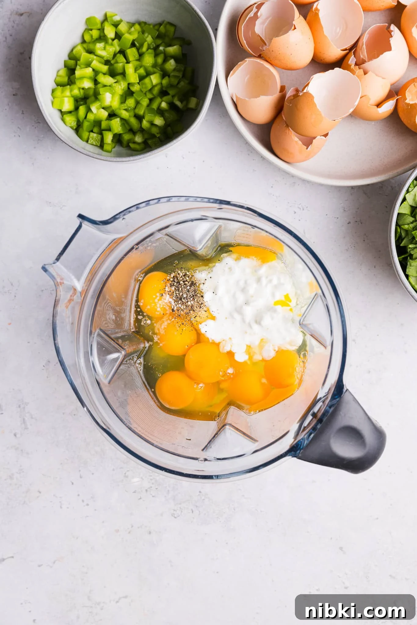 Ingredients for sheet pan eggs in a food processor.