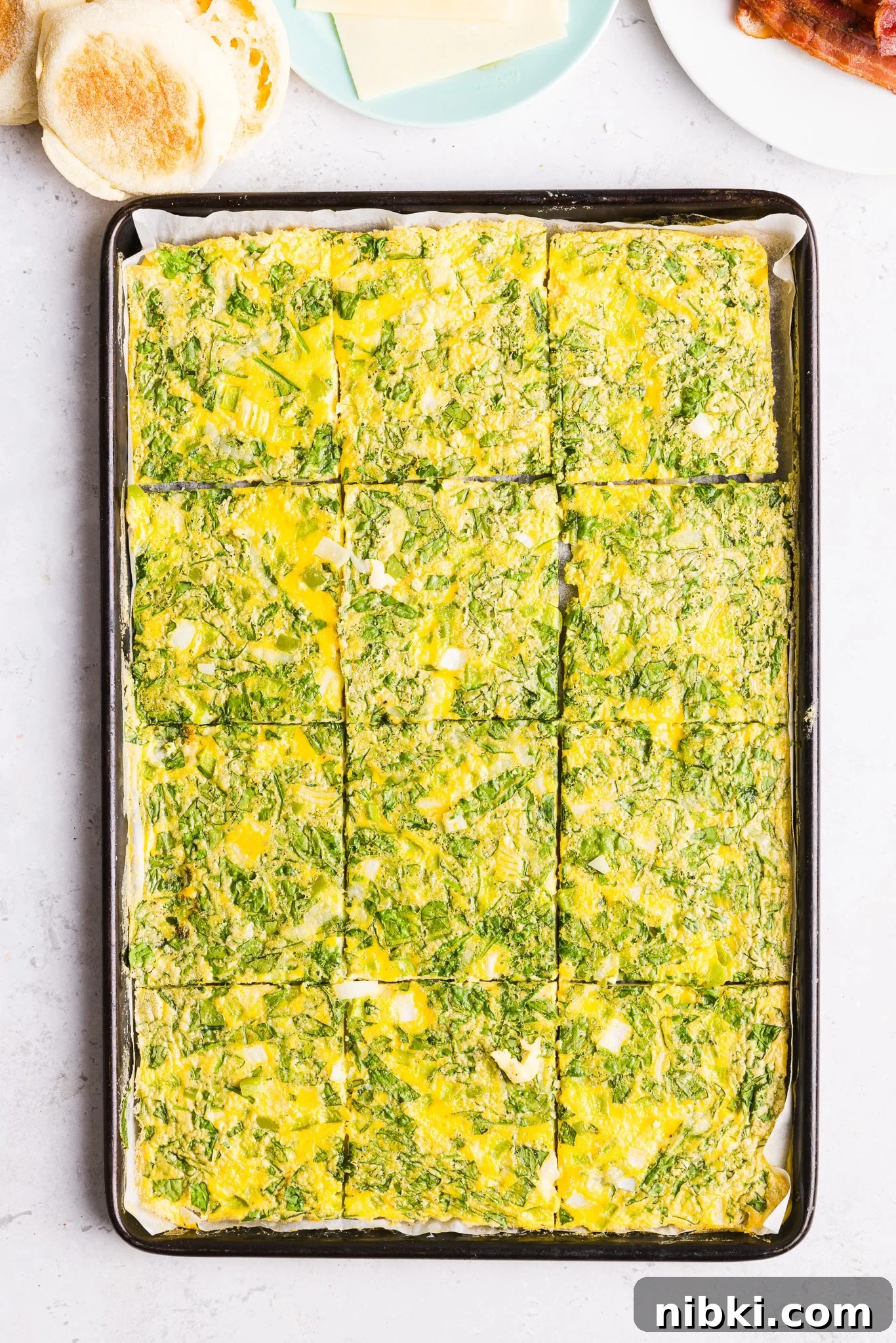 Sheet pan eggs sliced into 12 even slices.