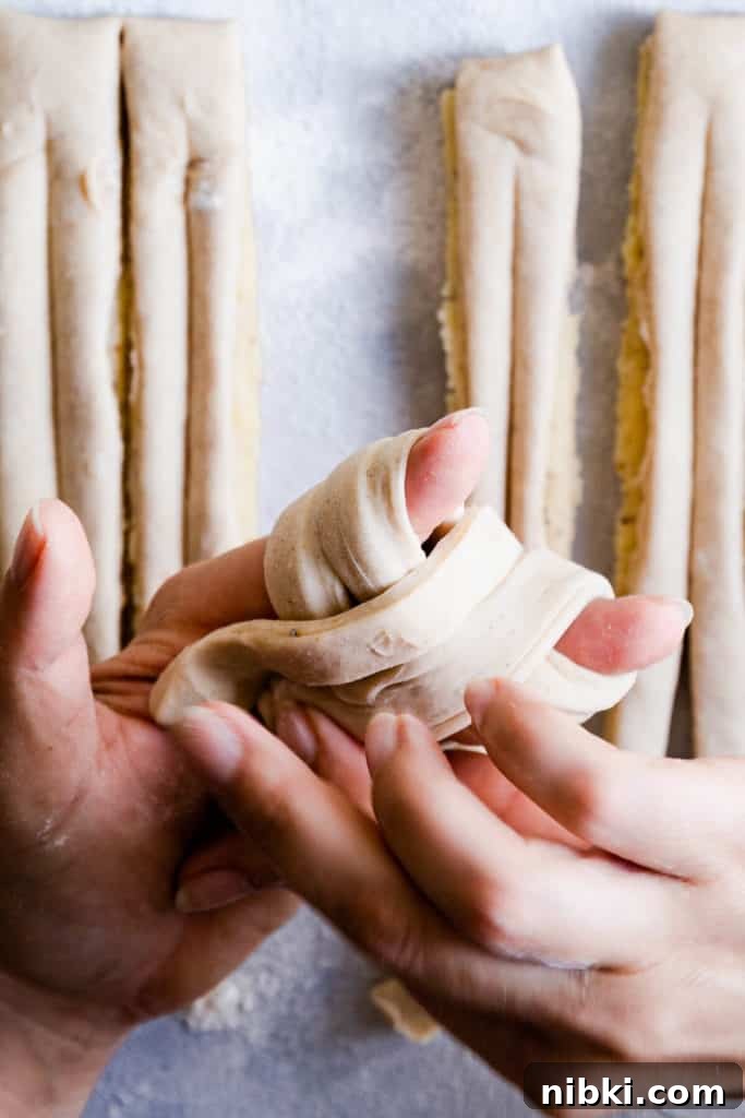 close up of hands shaping the dough