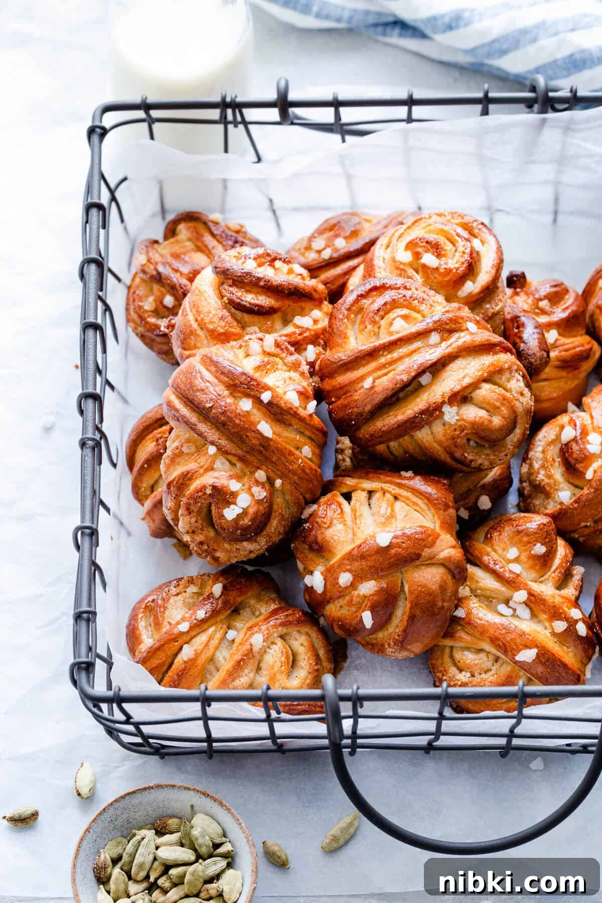 side close up of cardamom buns in a wired basket