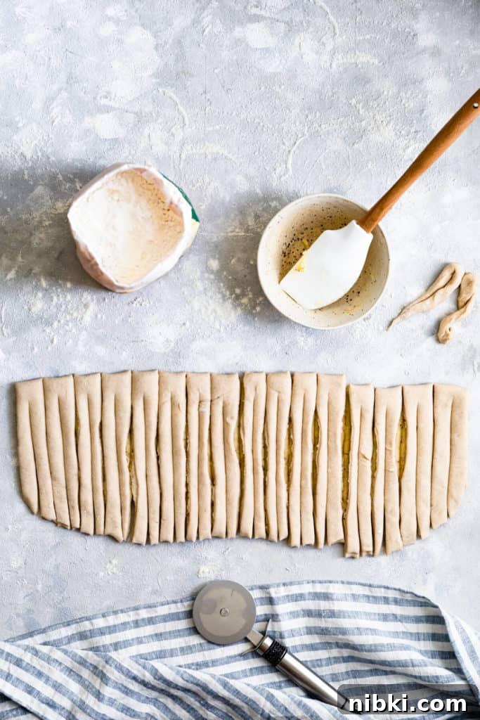 top view of a dough sliced into strips