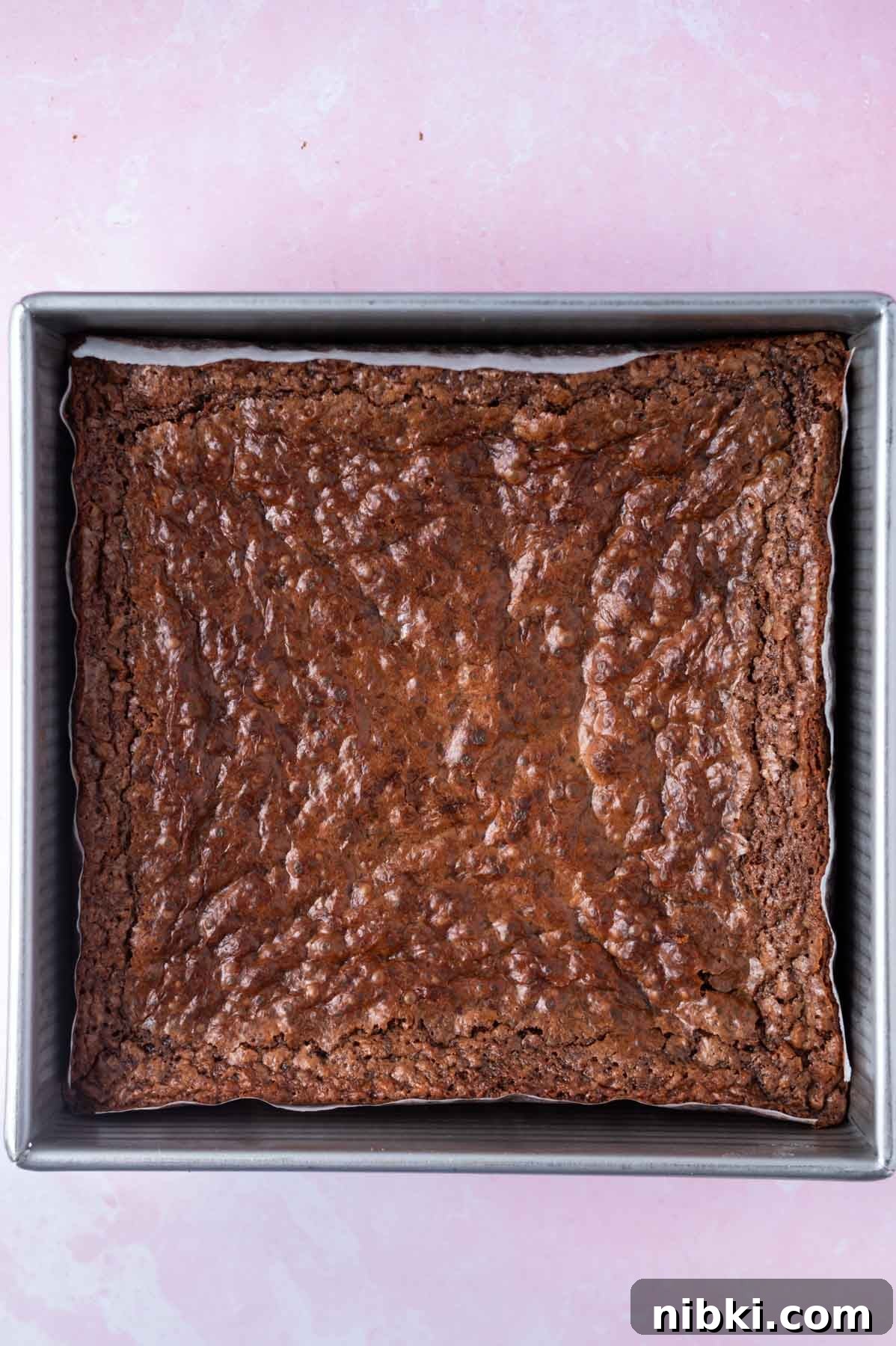 Fudgy Irish Cream Brownies Recipe 8 baked brownies in a parchment lined baking tin
