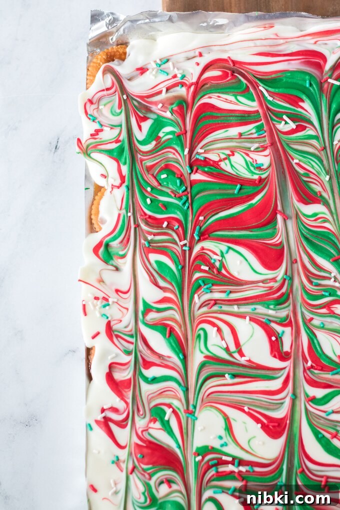 Christmas Crack: Saltine Toffee with Chocolate and Pecans 5 White chocolate being poured