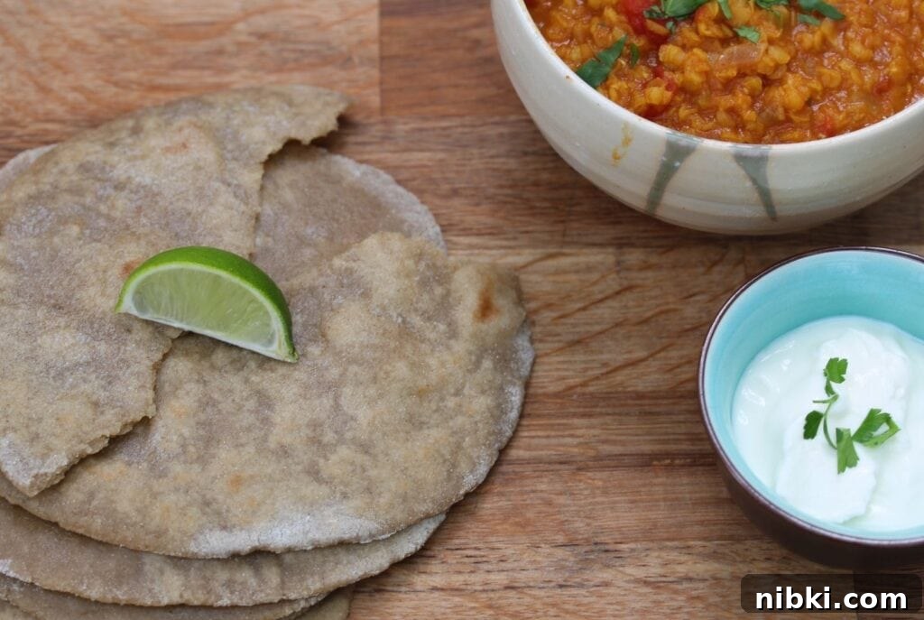 Gluten free chapatis photographed with a daal and yoghurt