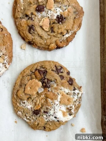 Chewy Pistachio Chocolate Chip Cookies Recipe 15 a few of the brown butter s'mores chocolate chip cookies on a baking sheet.