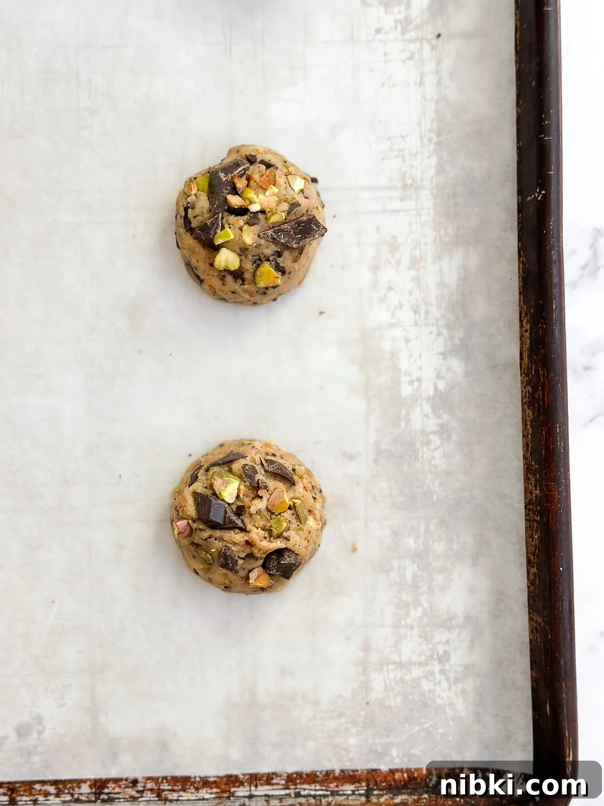 Chewy Pistachio Chocolate Chip Cookies Recipe 9 cookie dough balls before baking.