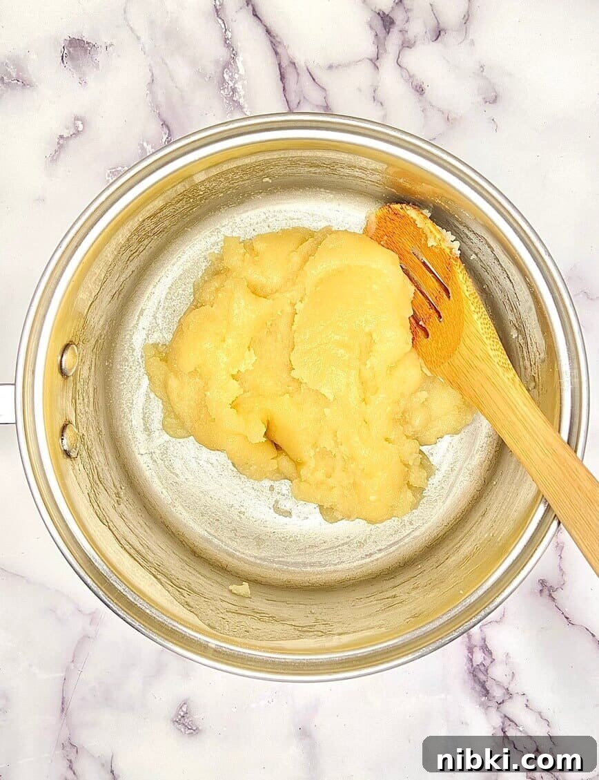 Zeppole di San Giuseppe: Classic St. Joseph's Pastry Recipe 6 Stirring the choux dough into a ball.