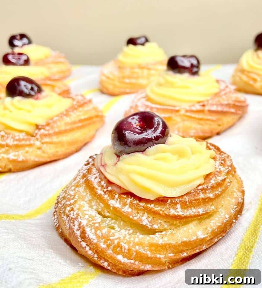 Zeppole di San Giuseppe: Classic St. Joseph's Pastry Recipe 3 Pastries finished with a cherry on top.