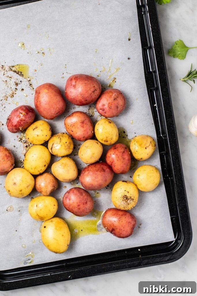 Italian Scarpariello Chicken with Peppers and Vinegar 8 A baking pan with red and white potatoes prepared to bake.