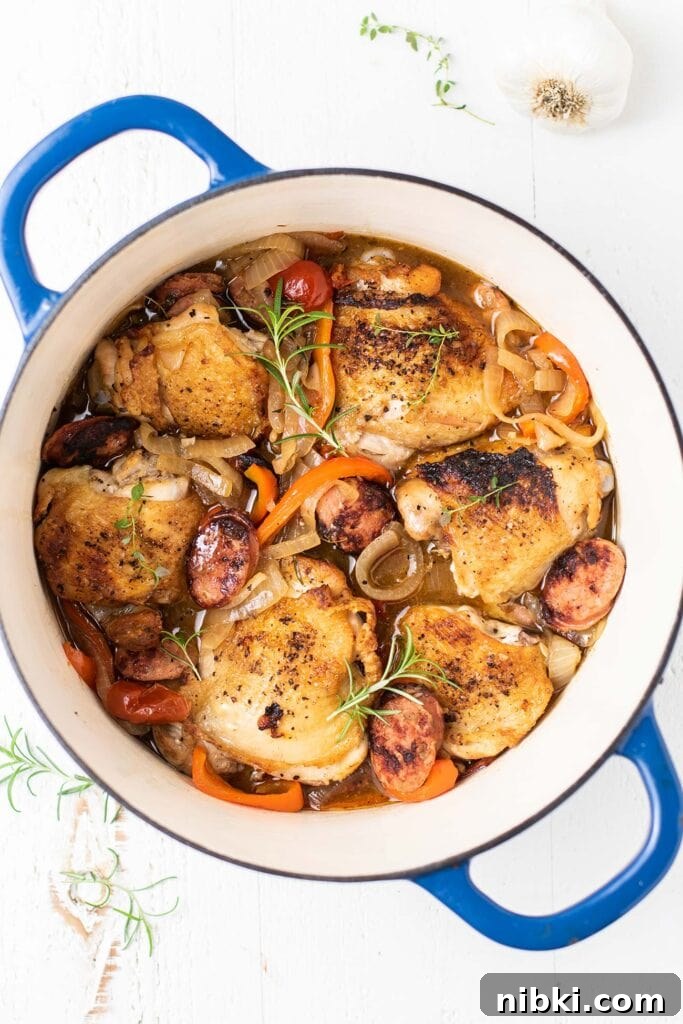 Italian Scarpariello Chicken with Peppers and Vinegar 9 A blue pot filled with chicken scarpariello.