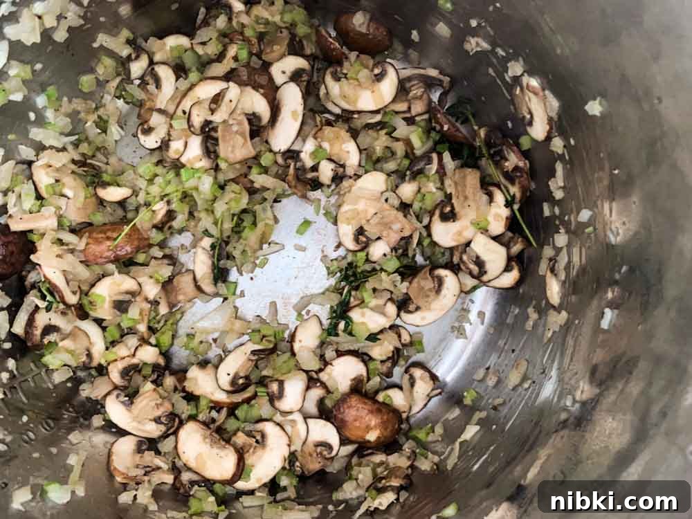 Instant Pot Creamy Mushroom and Spinach Risotto 6 Sauteed mushrooms, onions and celery in an Instant Pot.