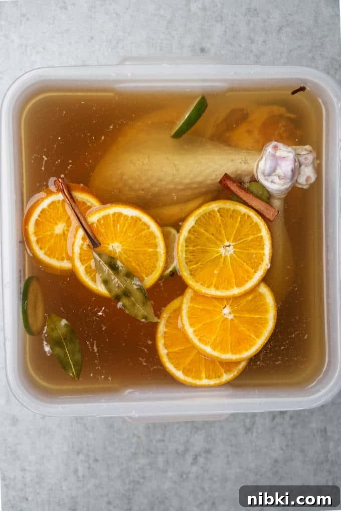 Traeger Smoked Turkey Brined with Brown Sugar and Bourbon 3 A turkey in a food grade bucket with bourbon brine.