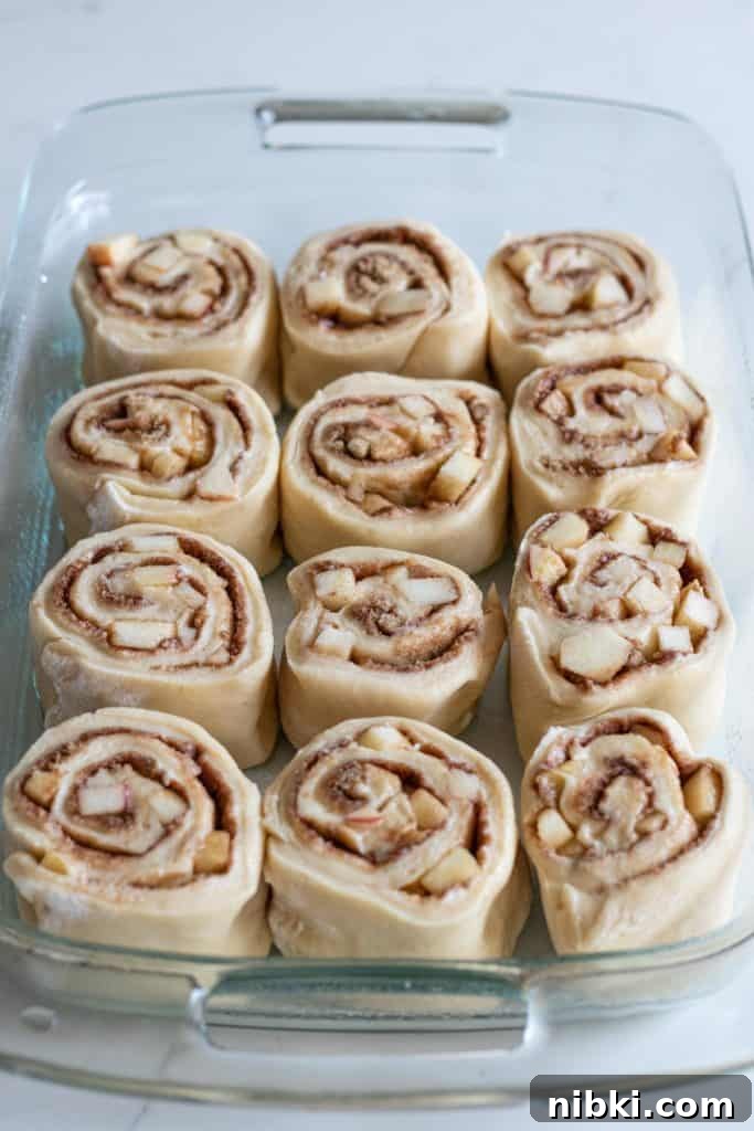 Apple Cinnamon Rolls Recipe with Brown Sugar Glaze 11 Apple cinnamon rolls in pan to be baked