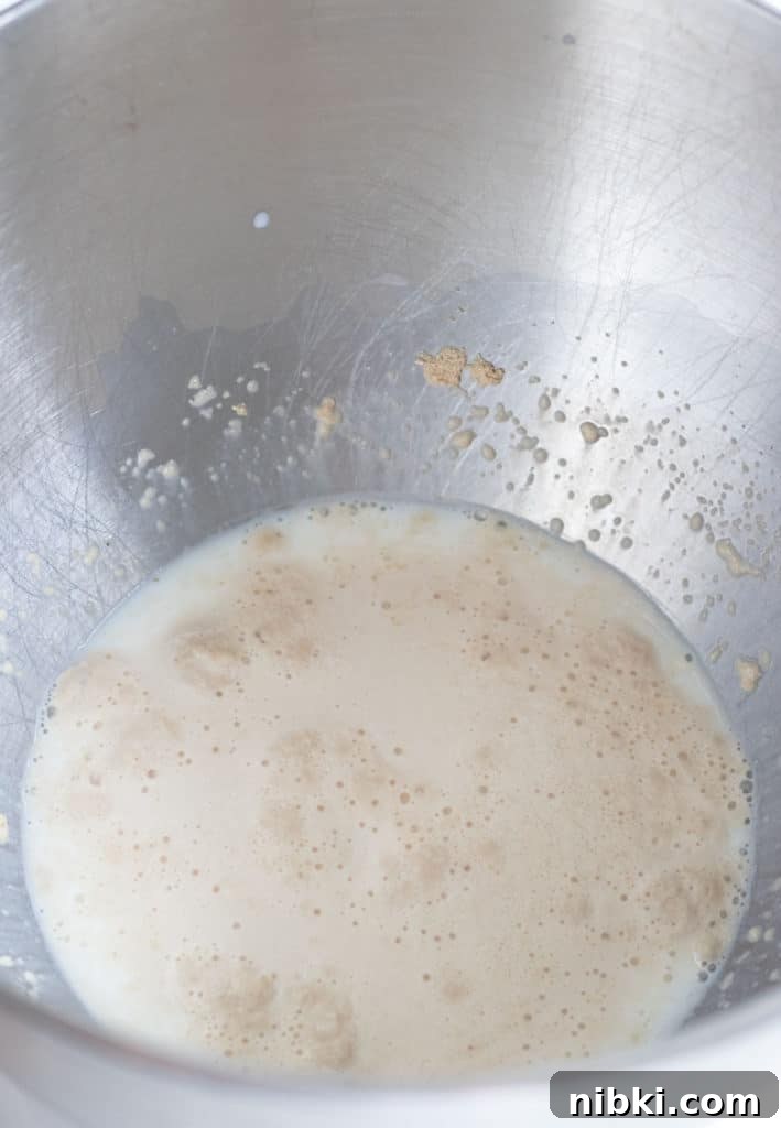 Apple Cinnamon Rolls Recipe with Brown Sugar Glaze 3 yeast that is foamy on top of warmed milk