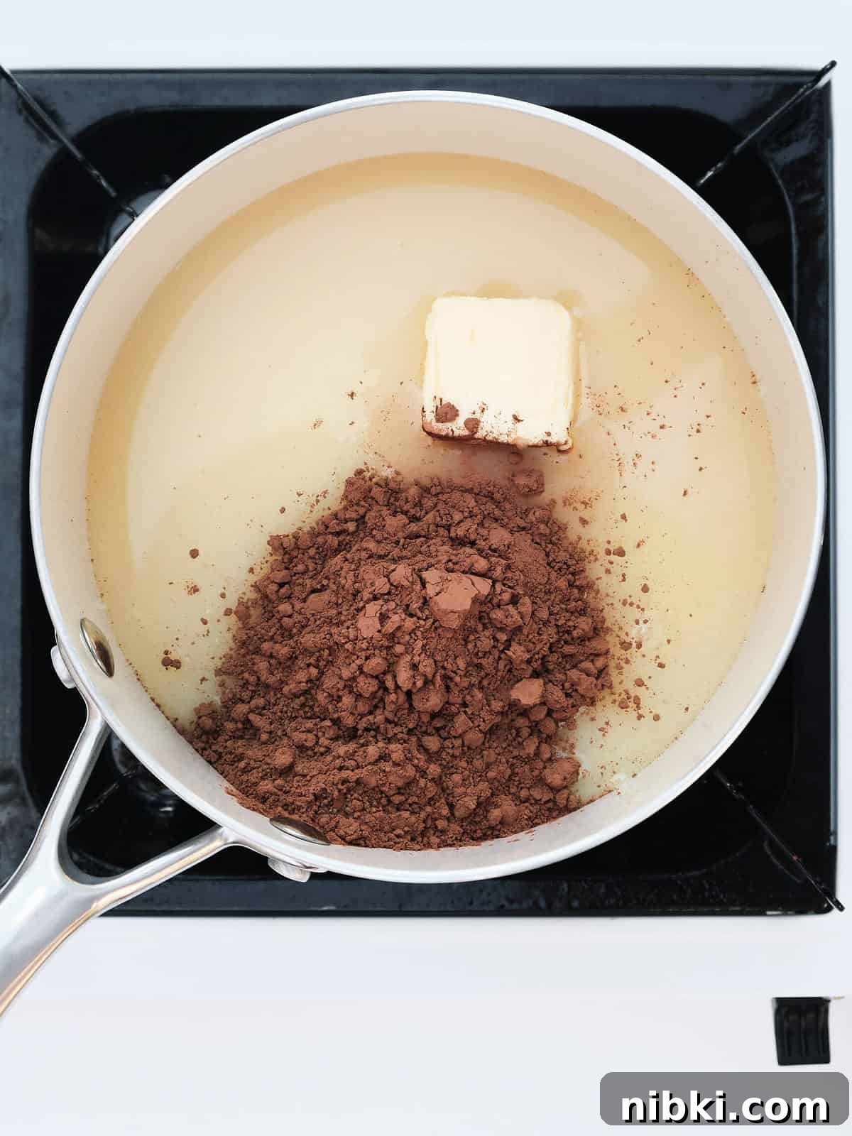 Sweetened Condensed Milk Truffles 5 Adding cocoa powder to sweetened condensed milk.