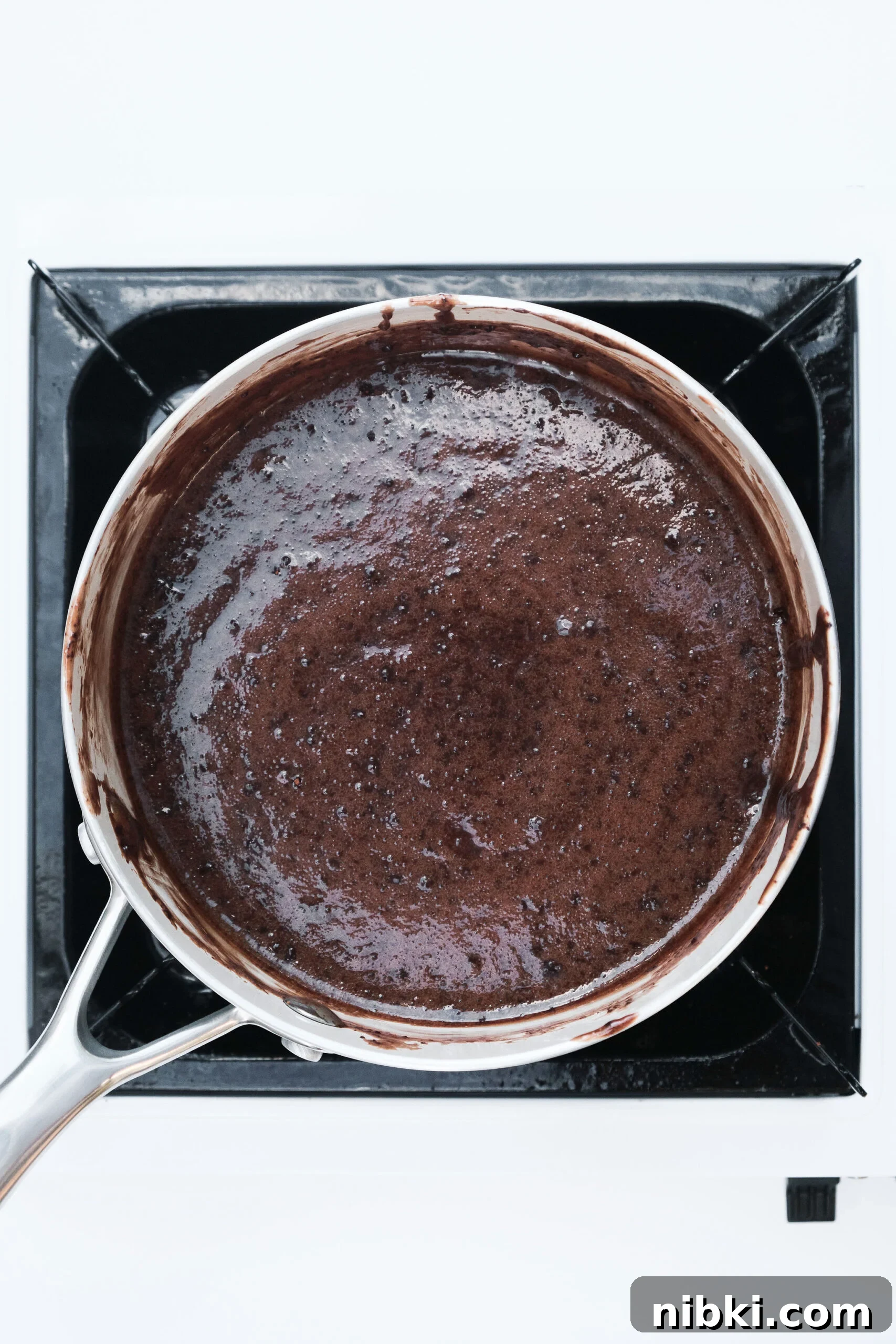 Sweetened Condensed Milk Truffles 6 Chocolate truffle mixture in saucepan thickened.