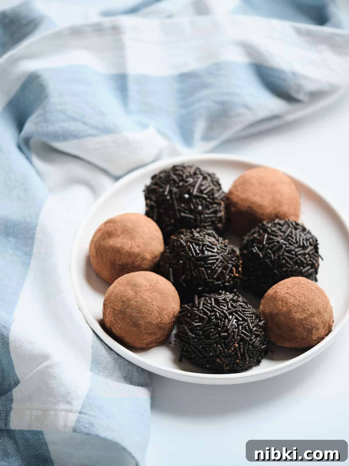 Sweetened Condensed Milk Truffles 8 Three ingredient chocolate truffles on a plate.