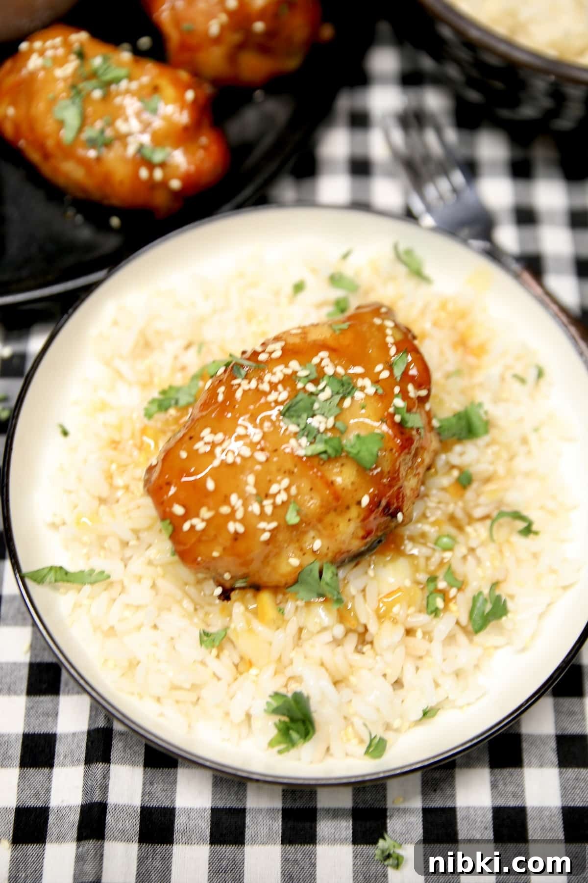 Plate of orange chicken and rice.