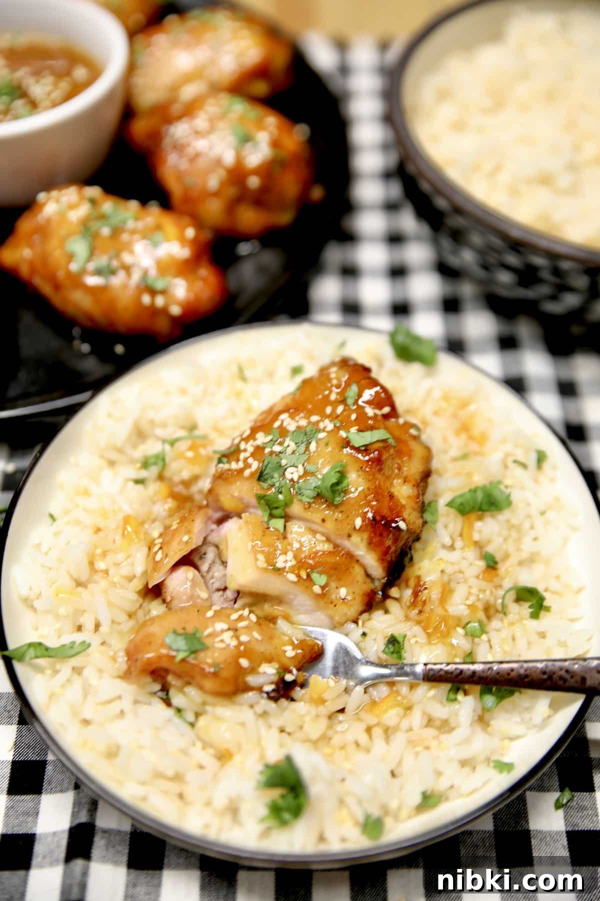 Chicken thigh on a plate with fork. 