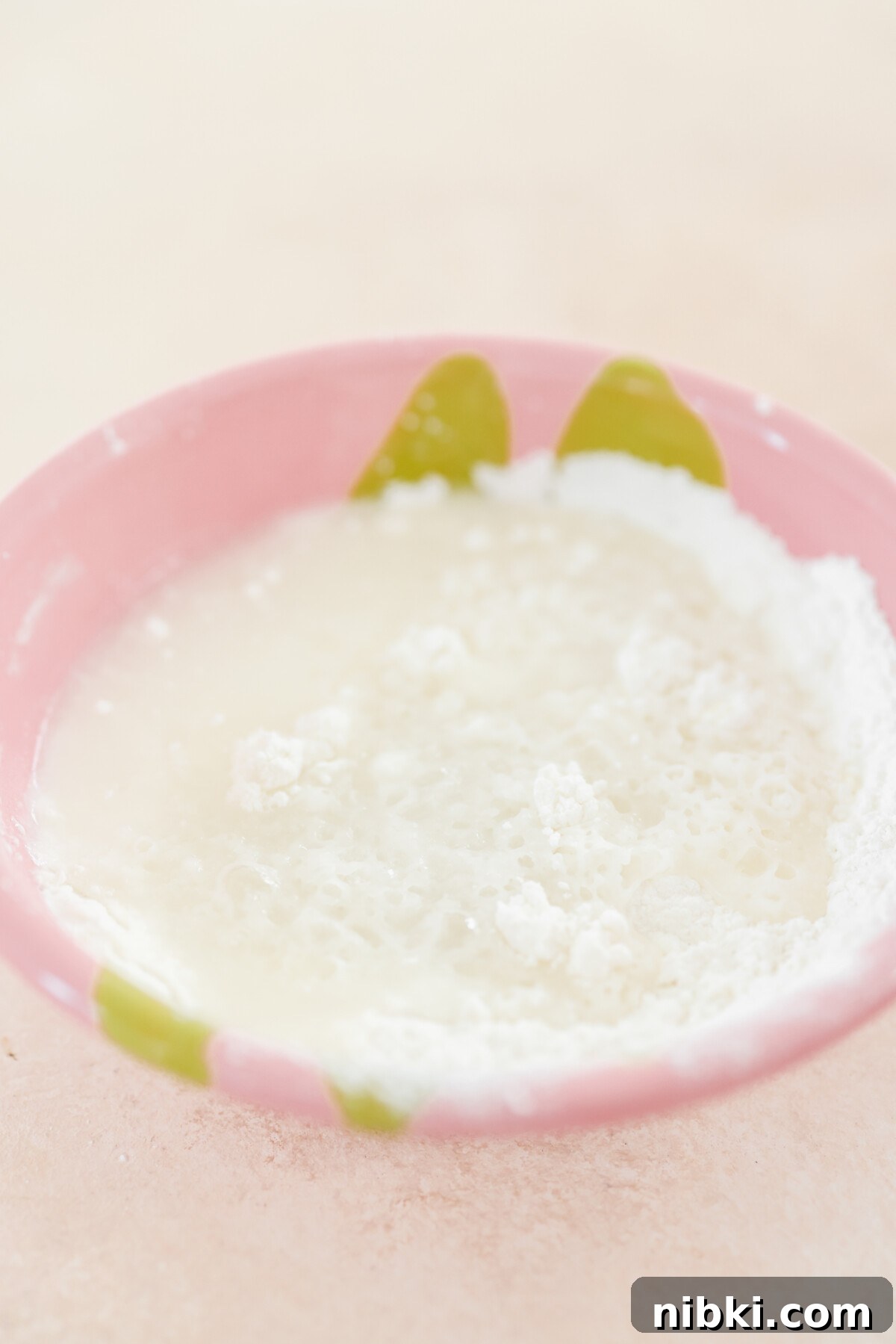 a pink bowl with recipe ingredients 