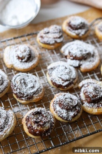 Nutella puff pastries on baking rack.