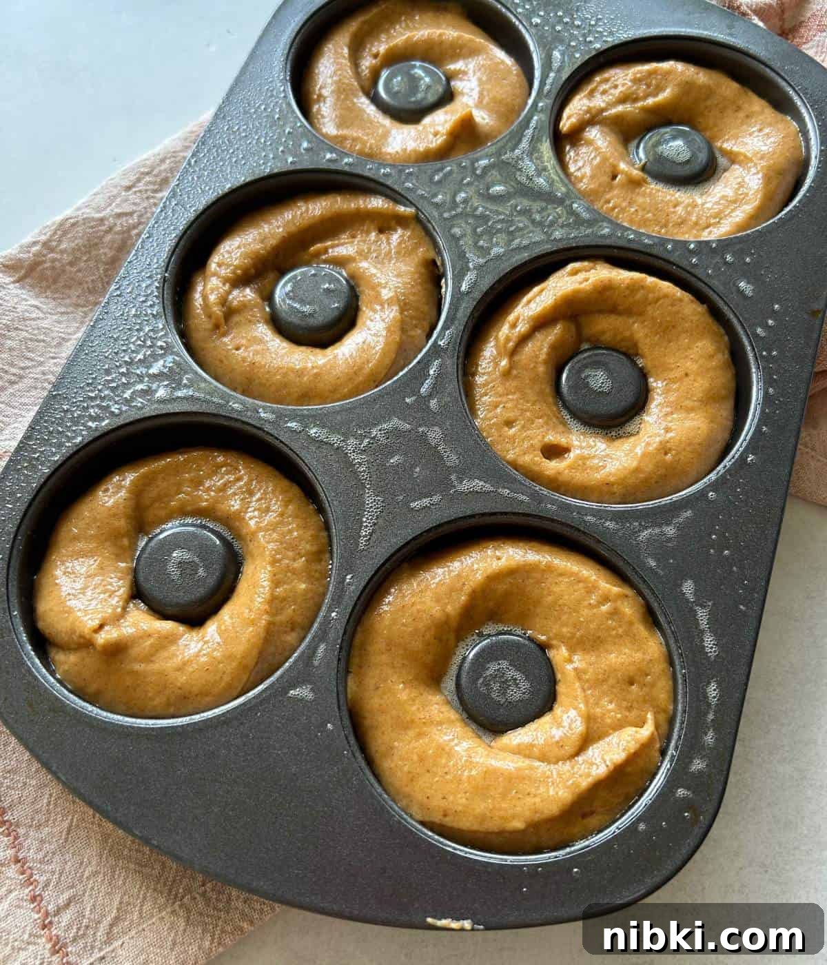 Donuts in baking tray.