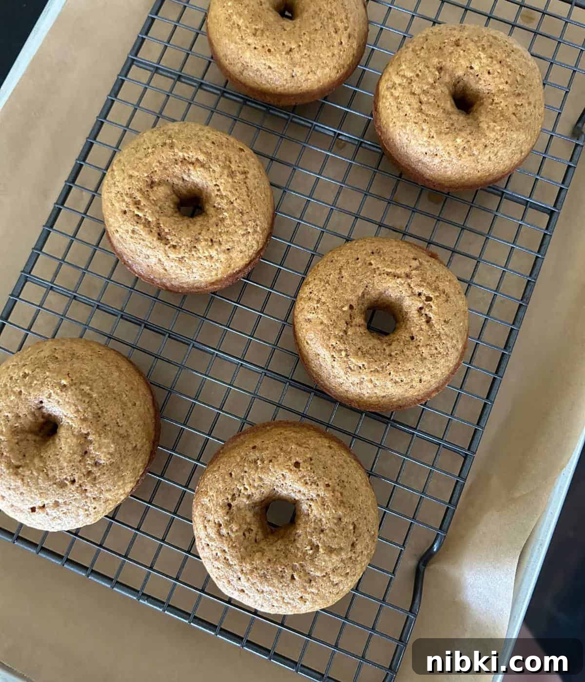 Baked donuts on rack.