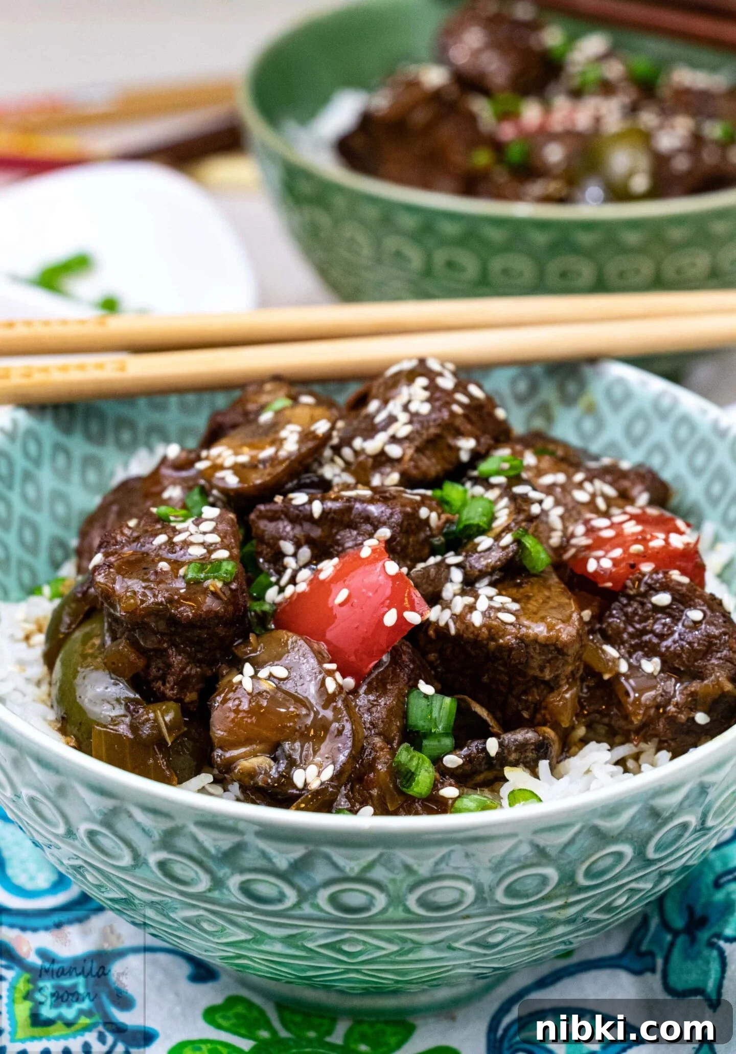 Cubes of sirloin steak are slow-cooked with bell pepper, onion, and mushrooms in a made-from-scratch teriyaki sauce until perfectly tender. Ladle a big scoop over cooked rice to satisfy those take-out cravings! Served teriyaki steak tips with rice