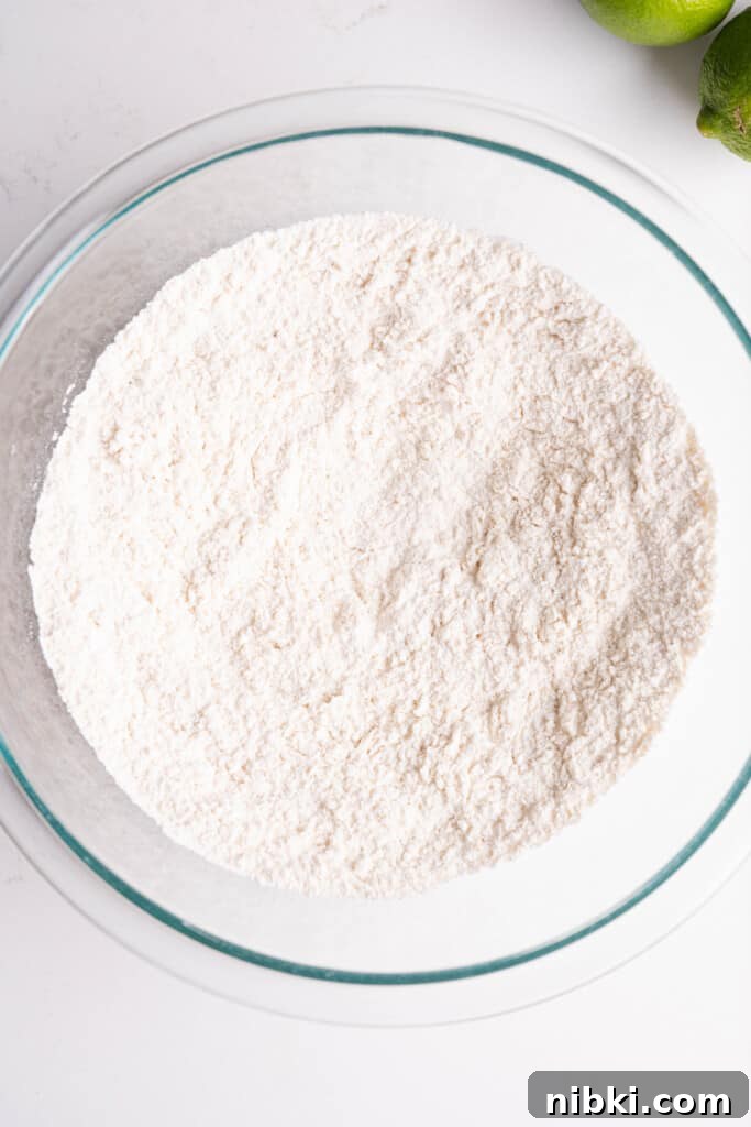 Crispy Puerto Rican Chicken Chicharrones 5 a bowl of seasoned flour