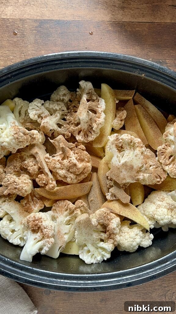 Greek braised cauliflower in a roasting pan with potatoes.