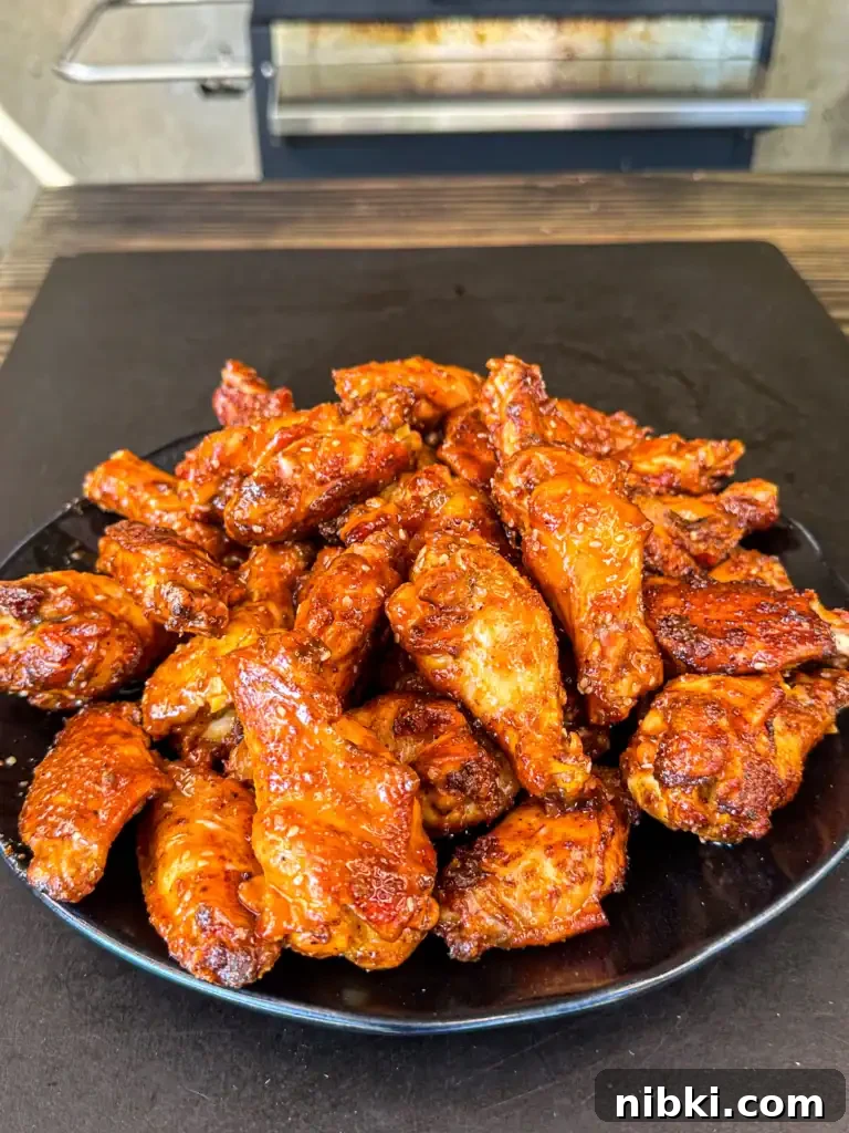 smoked and fried chicken wings with a hot honey garlic sauce