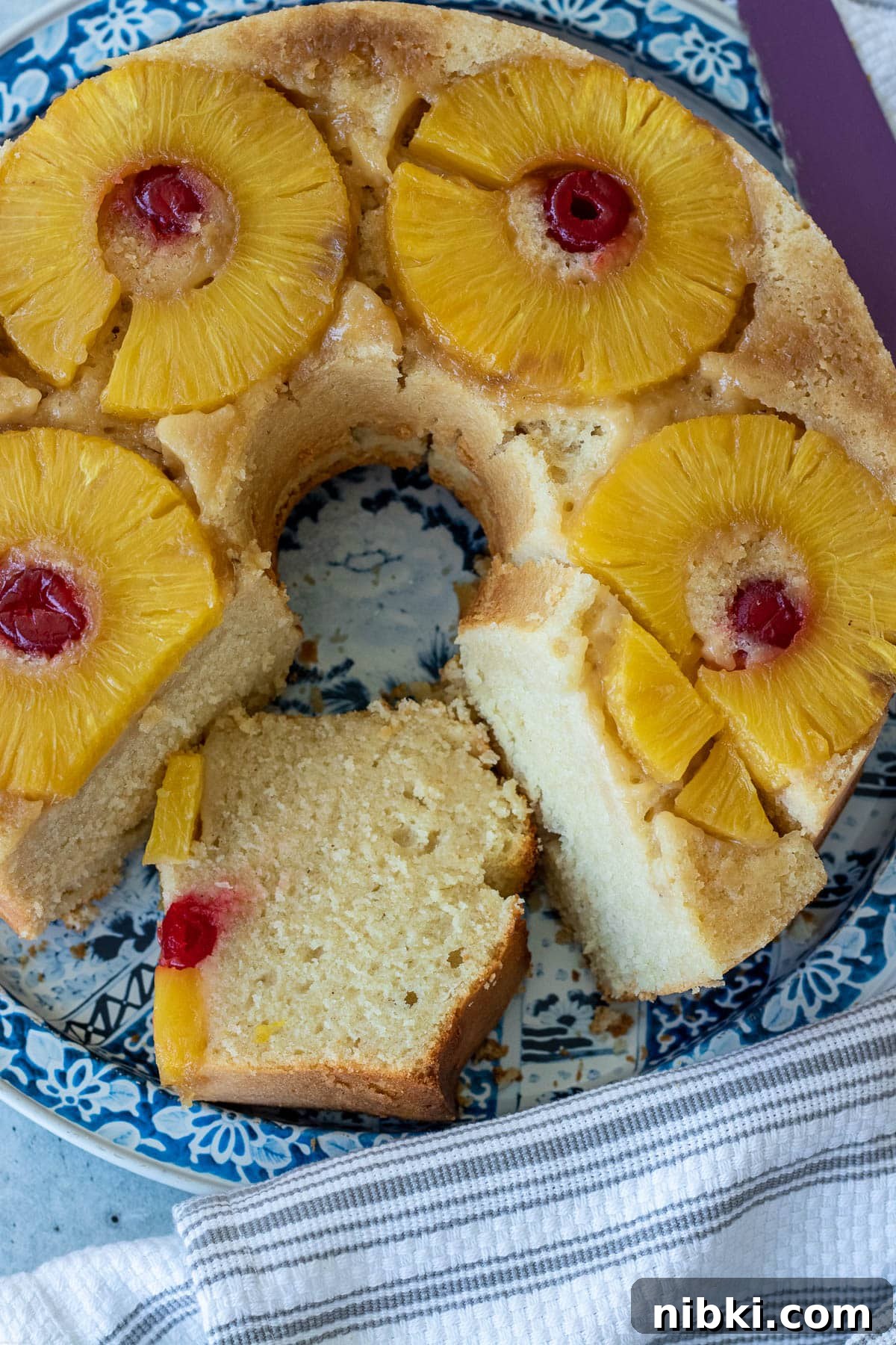 Moist Pineapple Upside-Down Pound Cake Recipe 2 Pineapple Upside Down Pound Cake with pineapple slices and maraschino cherries.