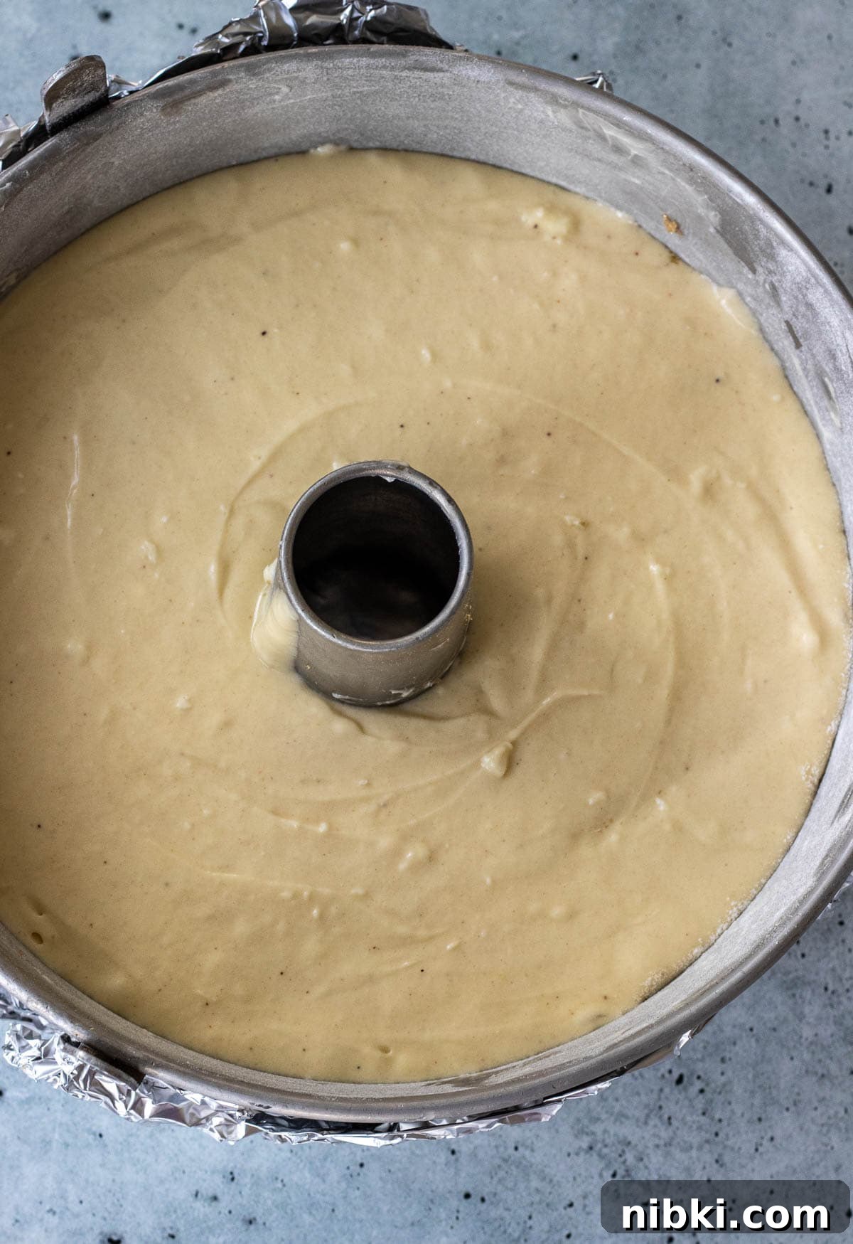 Moist Pineapple Upside-Down Pound Cake Recipe 8 Pound cake batter in a baking pan.