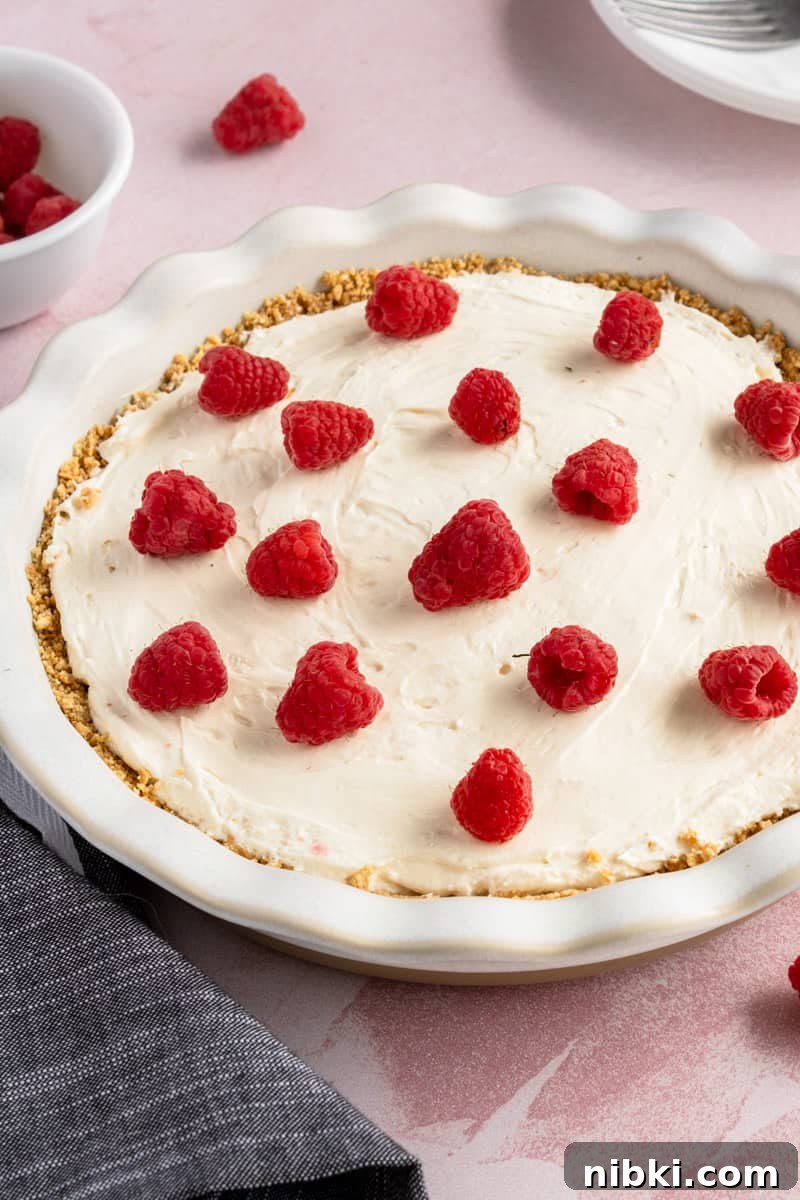 No-Bake Cream Cheese Pie Recipe 8 Cream cheese pie with raspberries.