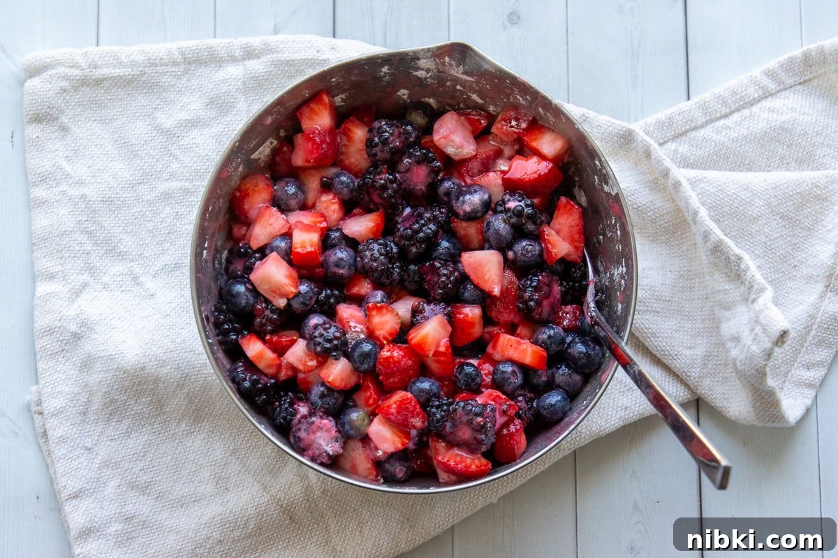 Mixed Berry Crumble Bars Recipe with Oat Streusel 5 Bowl of chopped mixed berries