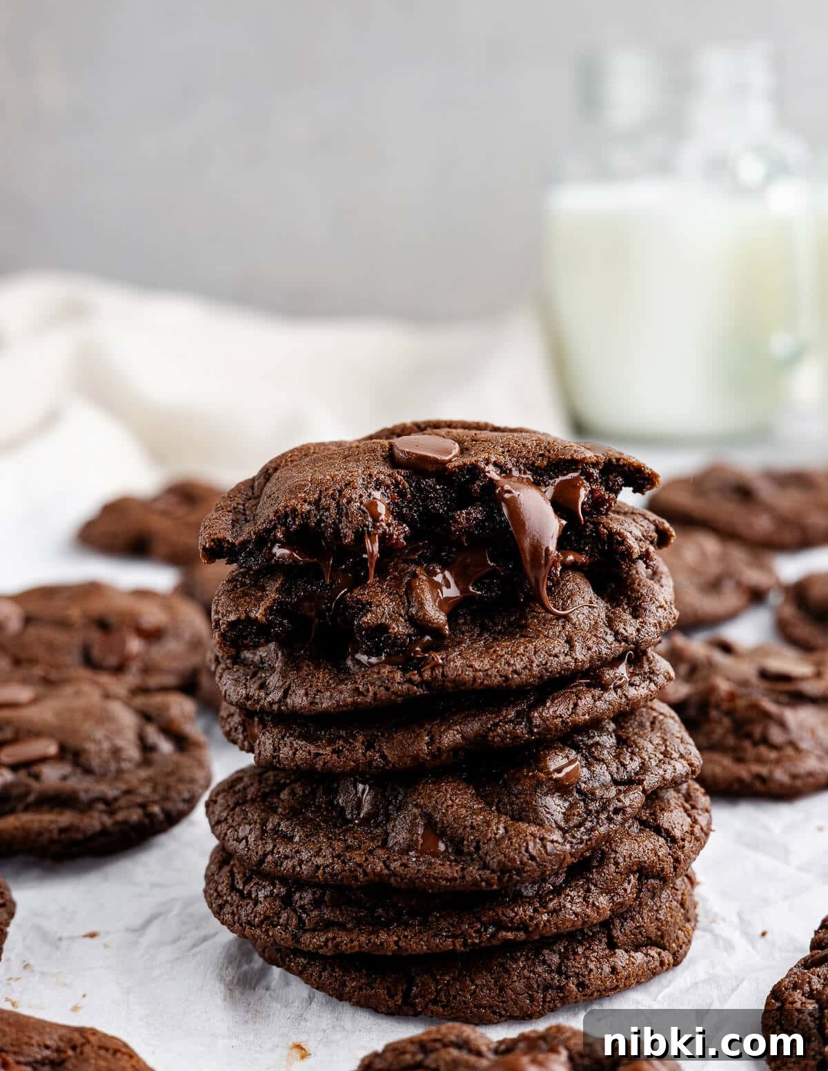 a stack of chocolate cookies with melted chocolate oozing out.