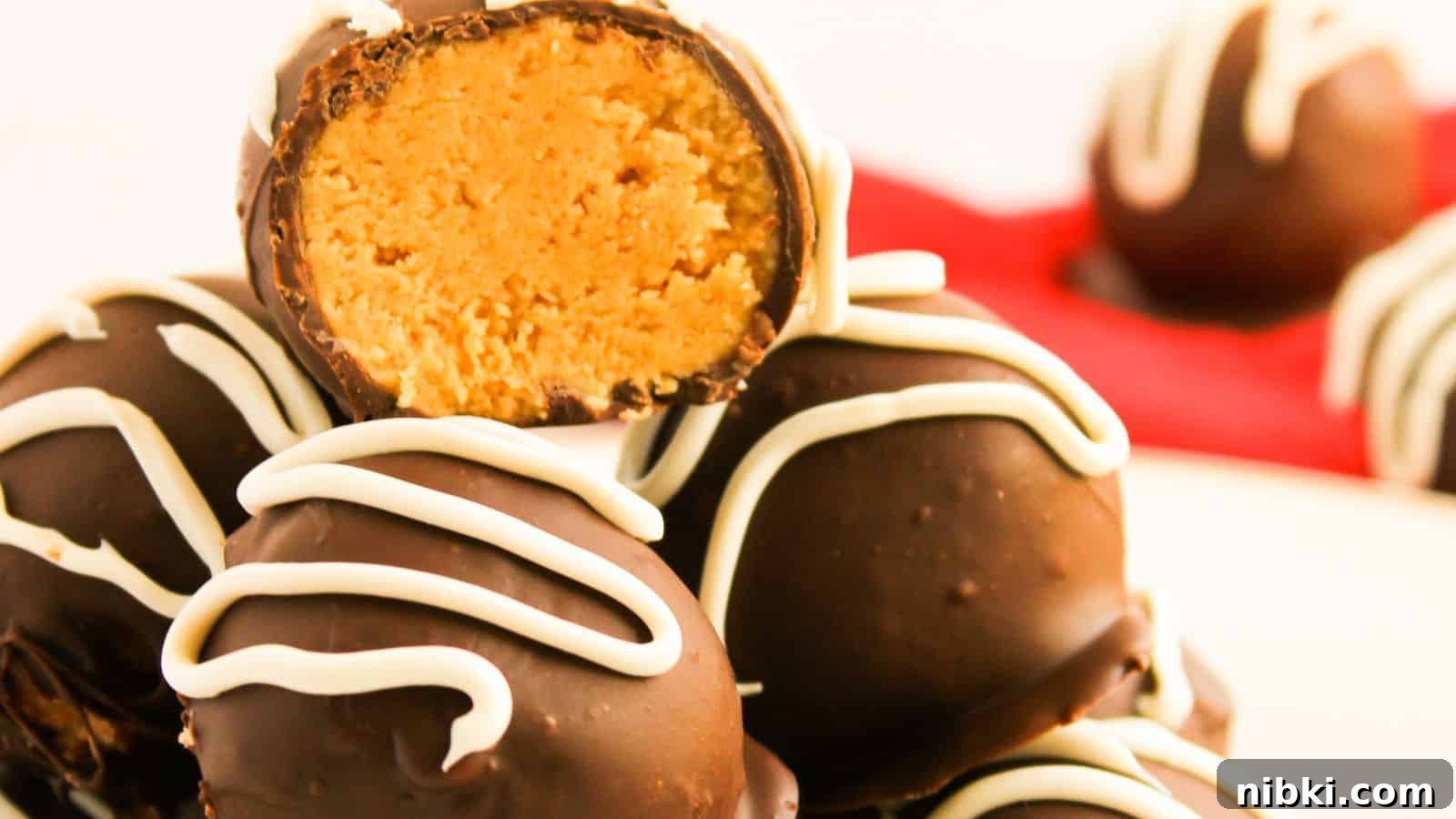 33 Christmas Potluck Recipes to Bring December Magic 14 A stack of chocolate truffles with white icing, one cut open to reveal a peanut butter filling.