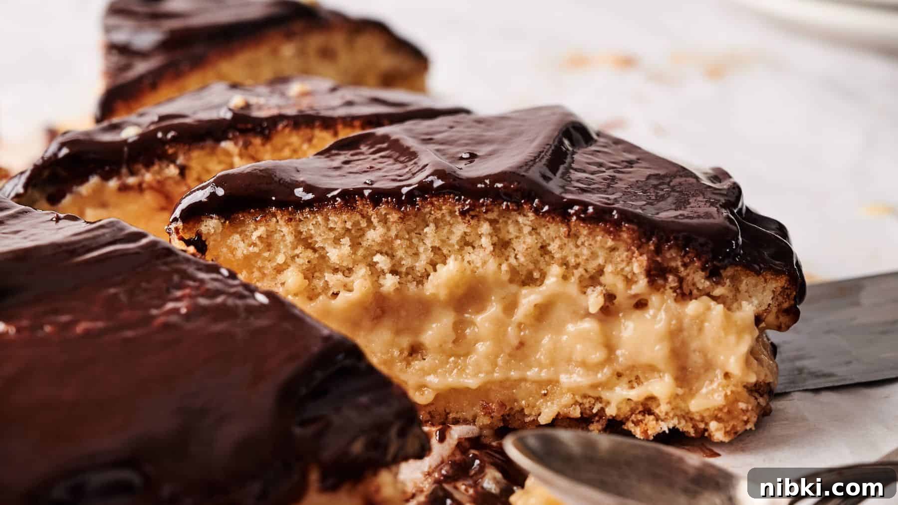 33 Christmas Potluck Recipes to Bring December Magic 6 A close-up of sliced Boston cream pie showing yellow sponge cake layers filled with creamy custard and topped with glossy chocolate glaze.