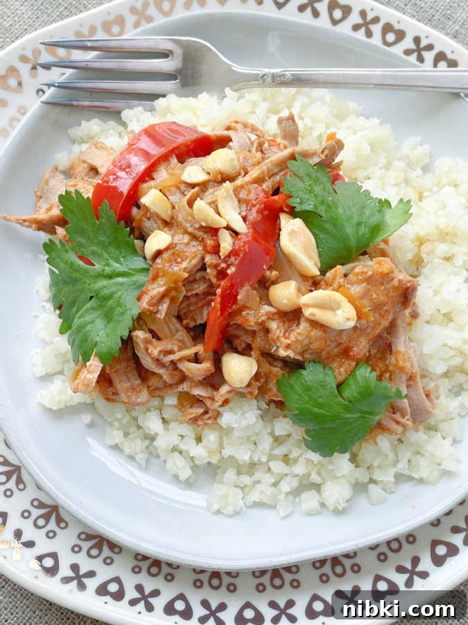 slow cooker satay pork served over cauliflower rice
