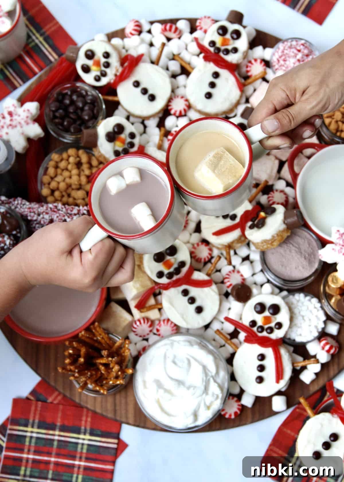 Holiday Hot Chocolate Board with Snowman Scotcheroos 7 Hot Chocolate Board with Snowmen Scotcheroos by The BakerMama