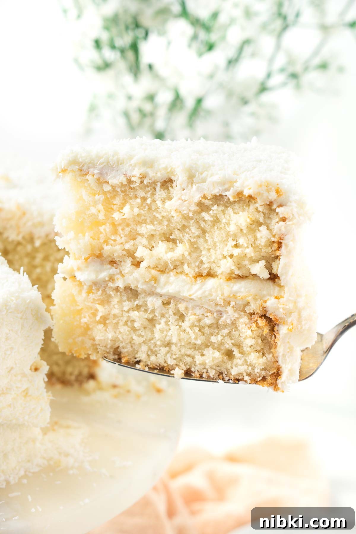 A slice of vegan coconut cake.