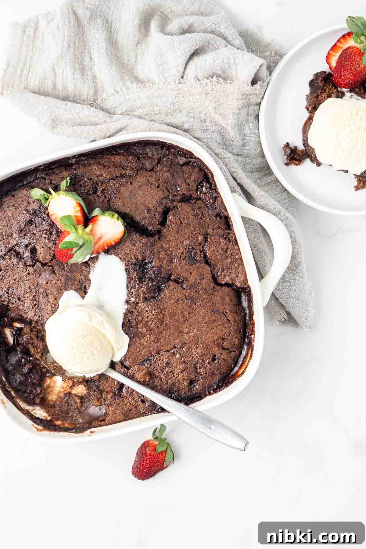 Chocolate self saucing pudding with ice cream.