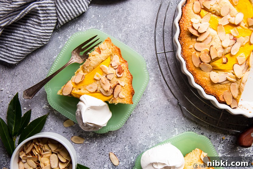 Tropical Mango Almond Cake Recipe 6 Overhead photo of a slice of tropical mango almond cake on a green plate