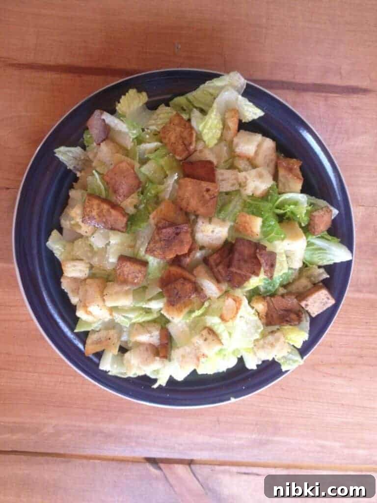 Week 1 Plant-Based Budget Challenge: Meal Plan for Two 9 Dinner plate filled with caesar salad with croutons and tofu.